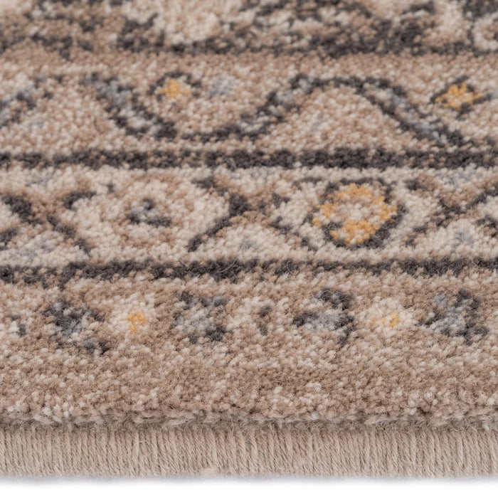 Details of edging on area rug made of wool with vintage details, in Storm Gray tones from the Acadia Collection at Kirishian Rugs