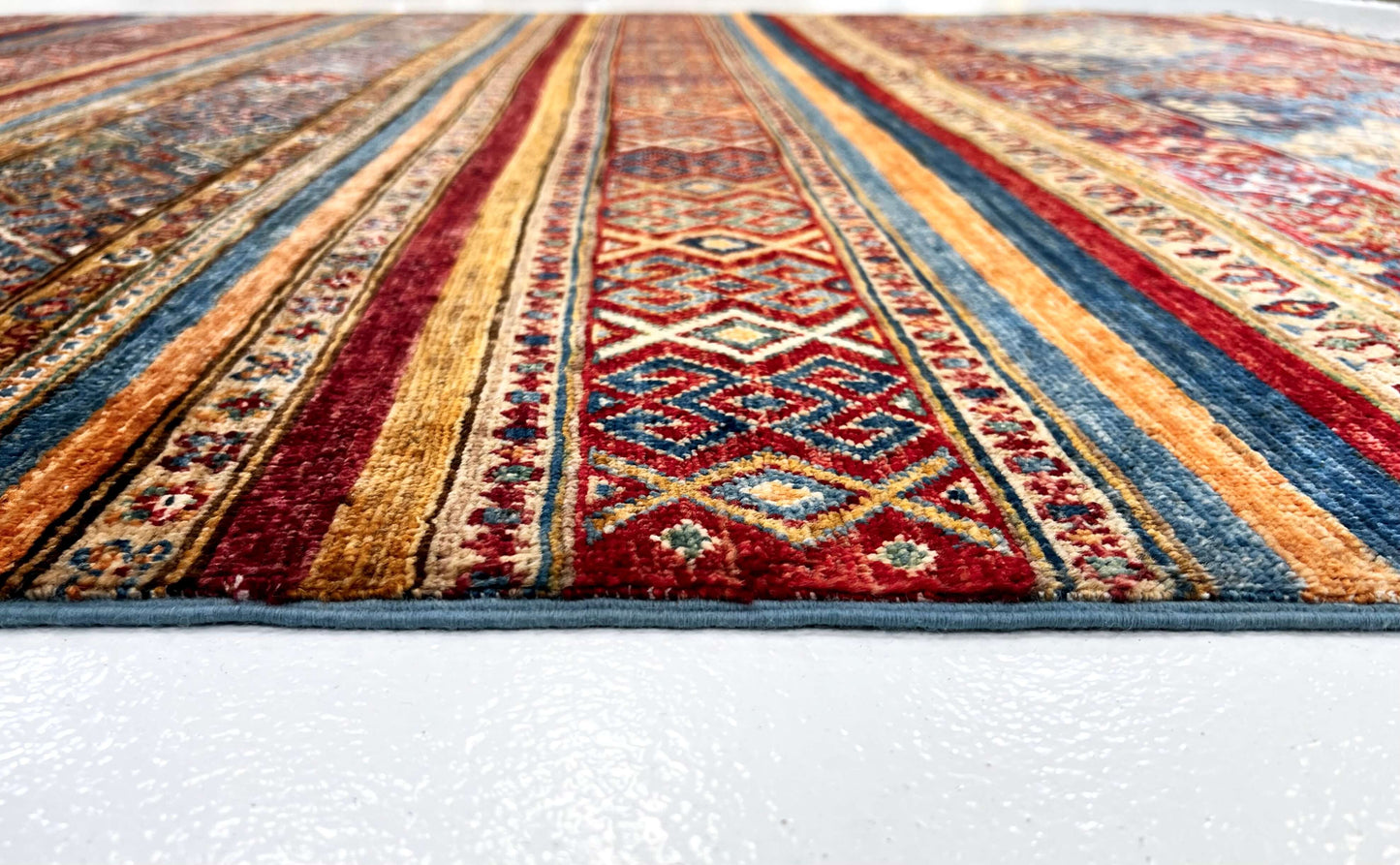 Khorjin (6'01"x8'07") blue/mulitcolor