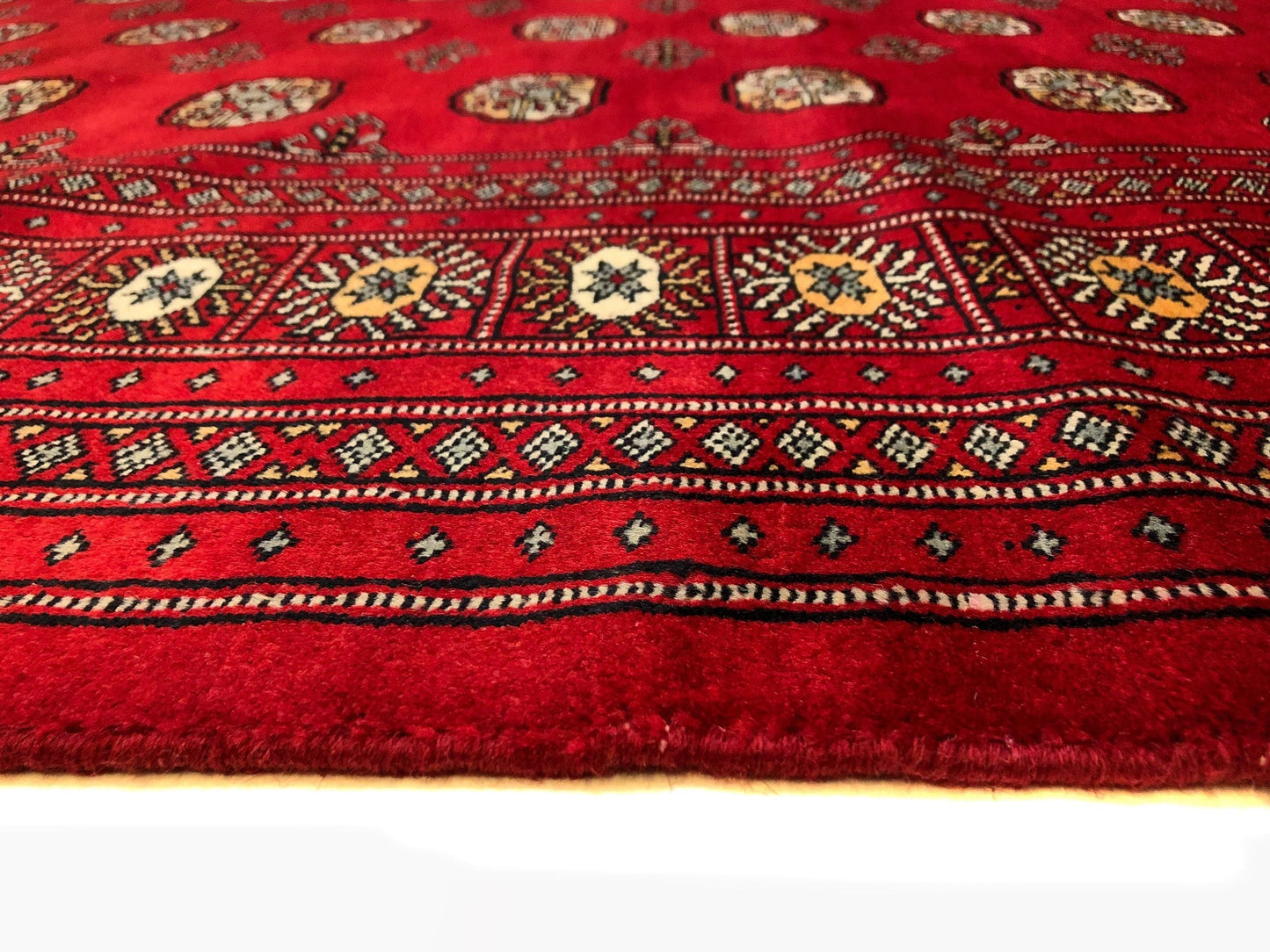 Up close details of the handmade Bokhara (9x12) rug