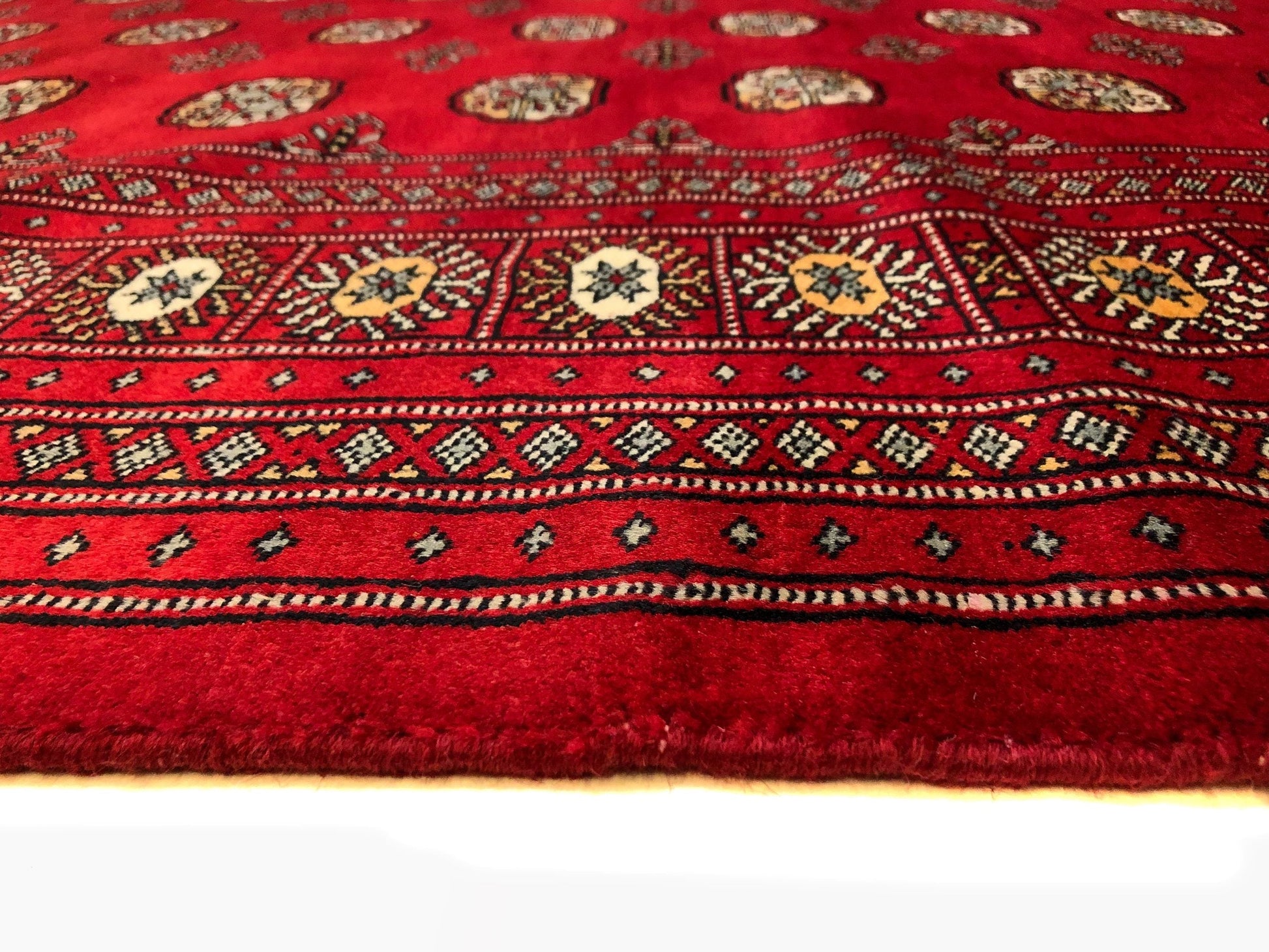 Up close details of the handmade Bokhara (9x12) rug