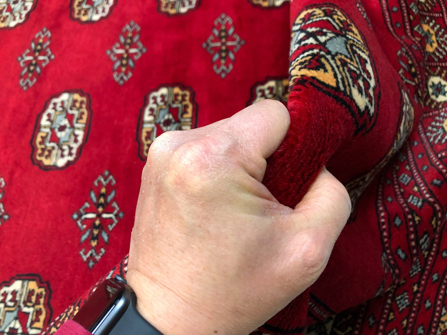 Up close details of the Bokhara (9x12) red imported area rug