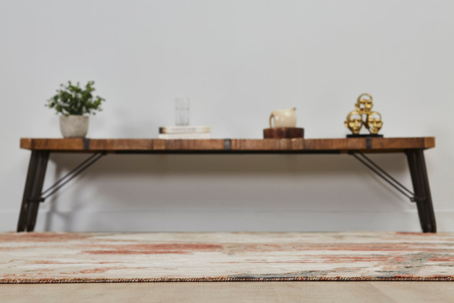 Floor angle/view of Rust/Sand Abstract Area Rug -Vaughn Collection with table in background